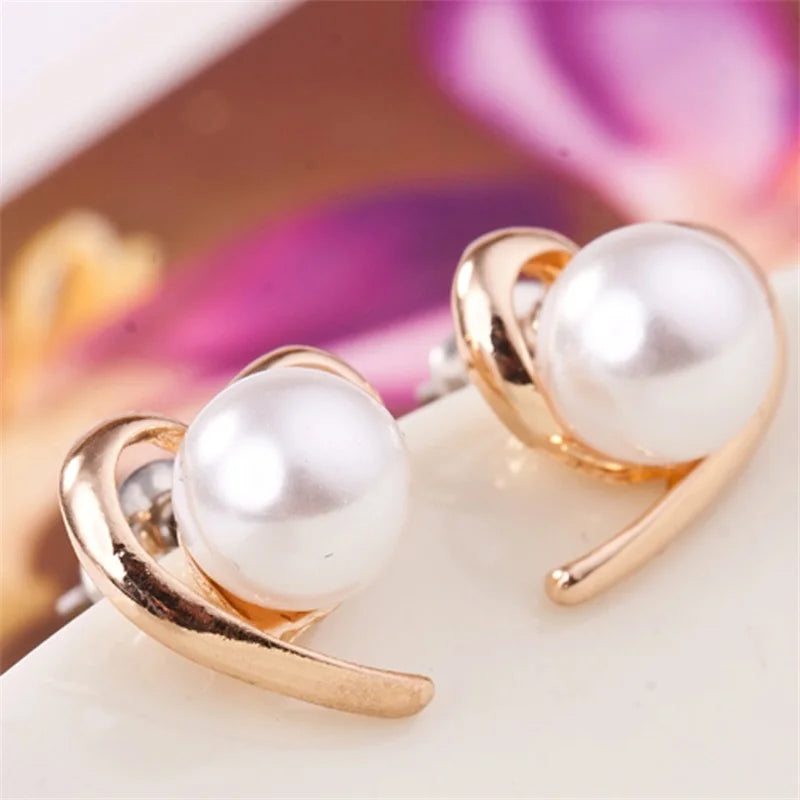 Fashion jewelry earrings featuring delicate floral design, by Corporación Turística, showcasing elegant, colorful flower-shaped earrings.