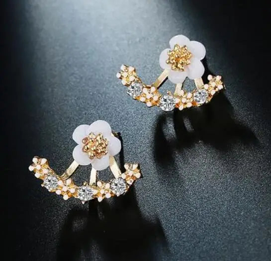 Fashion jewelry earrings featuring delicate floral design, crafted by Corporación Turística, perfect for stylish accessorizing.