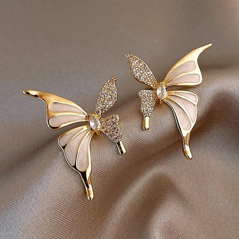 Elegant butterfly-shaped fashion earrings for women, featuring colorful designs and intricate details.