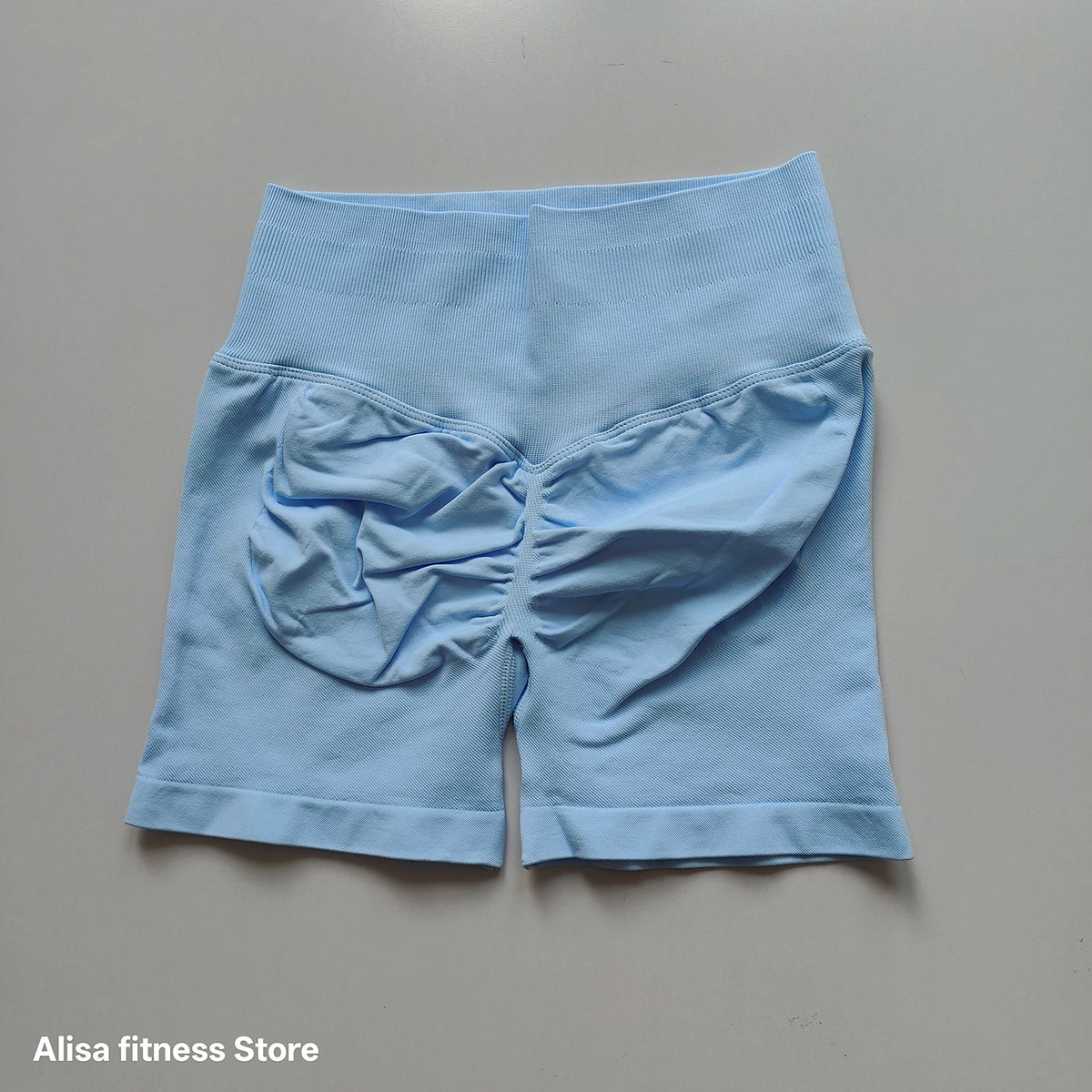 Dark gray high-waisted yoga shorts from Corporación Turística, seamless design, perfect for summer workouts.
