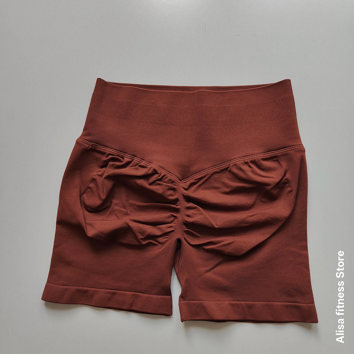 Dark gray high-waist yoga shorts by Corporación Turística, seamless summer activewear for women, suitable for yoga and workouts.