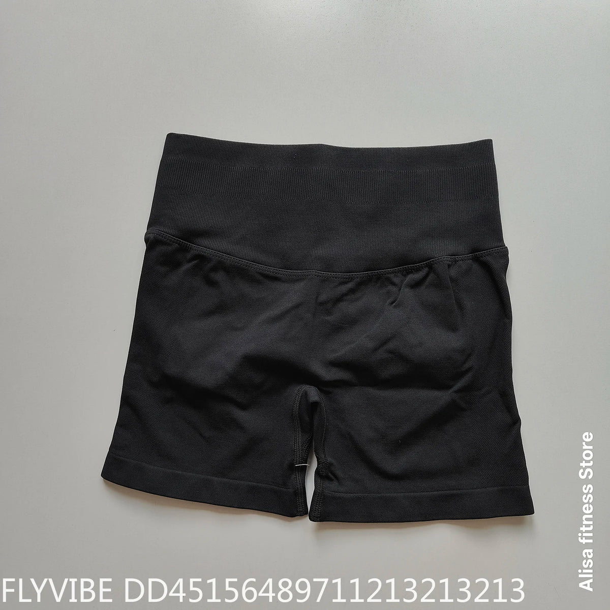 Dark gray high-waist yoga shorts from Corporación Turística, seamless design, perfect for summer workouts and active wear.