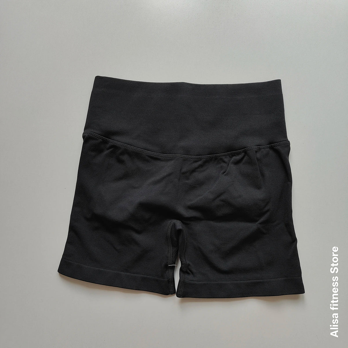 Dark gray high-waist yoga shorts by Corporación Turística, seamless design, perfect for summer workouts and active wear.