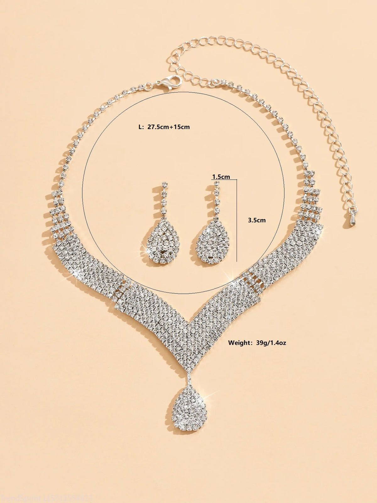 Fashion jewelry set with drop-shaped rhinestone earrings and necklace from Corporación Turística in a gold tone.