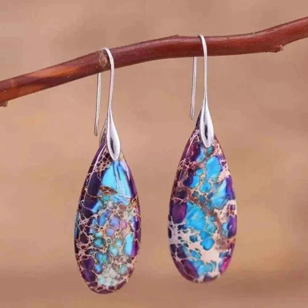 Natural jaspe stone pendant earrings in teardrop shape, crafted by Corporación Turística, hanging with intricate design details.