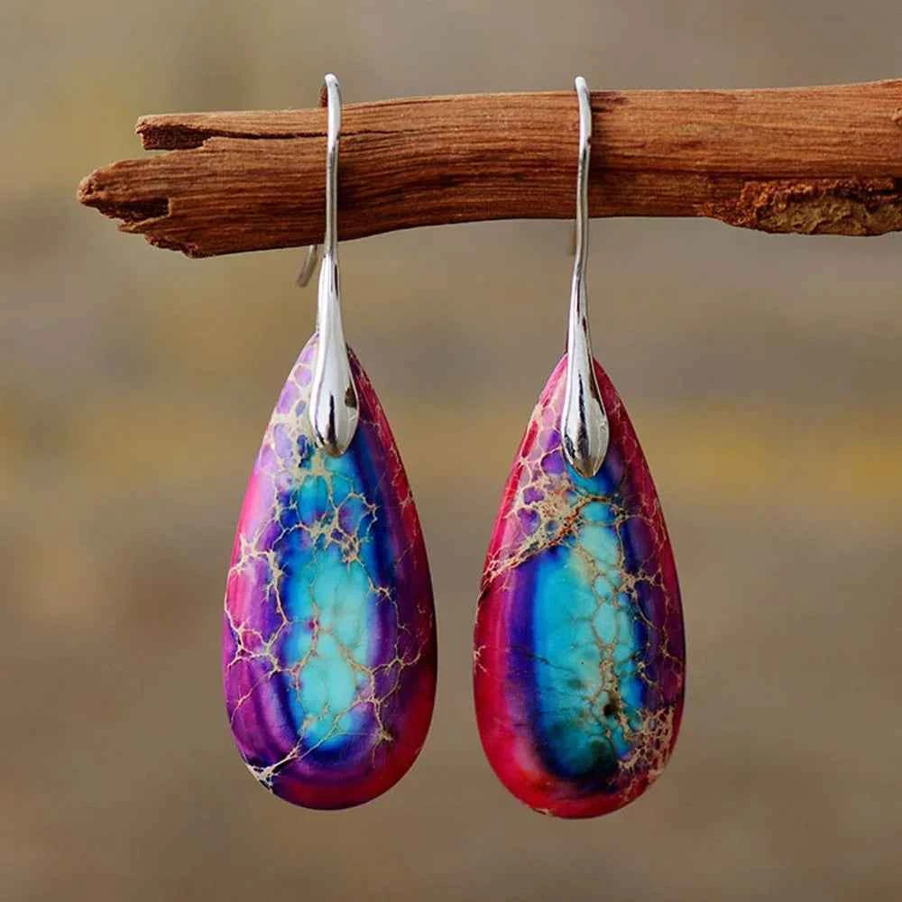 Natural jasper stone pendant earrings with teardrop shape from Corporación Turística, featuring earthy tones and polished surface.