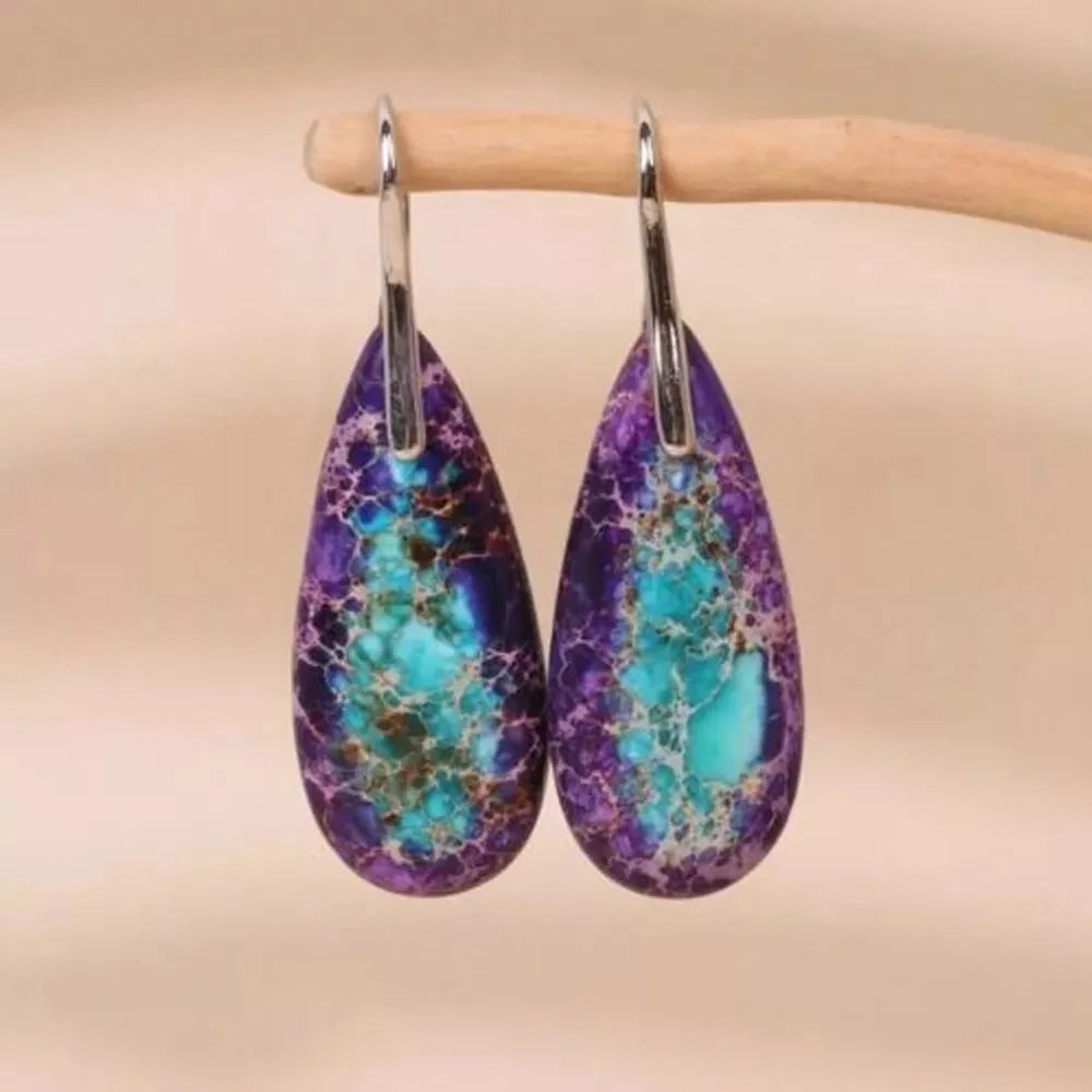 Natural Jasper stone pendant earrings with teardrop shape, crafted by Corporación Turística, featuring earthy, polished stone details.