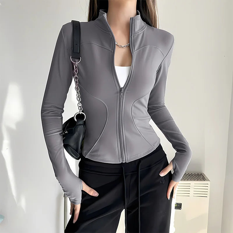 Pink women's quick-dry sports jacket with zipper from Corporación Turística, suitable for active wear and outdoor activities.
