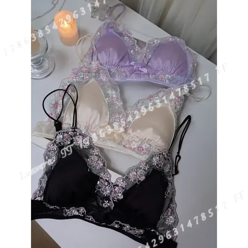 Luxury silk lace lingerie set by Corporación Turística featuring black lace and delicate fabric, displayed on a mannequin.