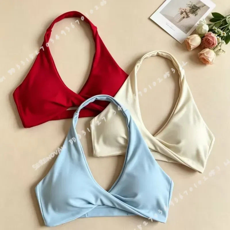 Scarlet red women's halter sports bra with open back from Corporación Turística, ideal for active wear and workout sessions.