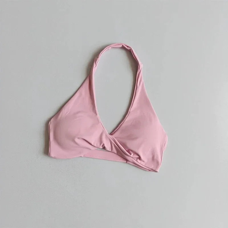 Scarlet red women's halter sports bra with open back by Corporación Turística, featuring supportive fit and stylish design.