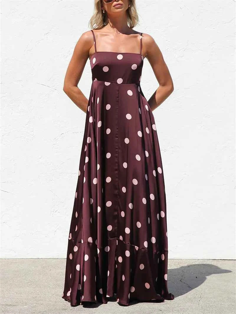 Fucsia long women's dress with thin straps, elegant and flowy, by Corporación Turística, ideal for summer or formal occasions.
