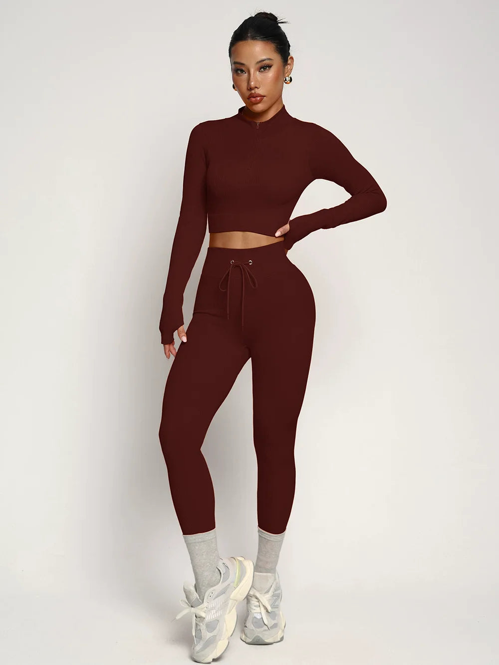 Fashionable two-piece yoga suit by Corporación Turística, featuring comfortable athletic wear for yoga and fitness activities.
