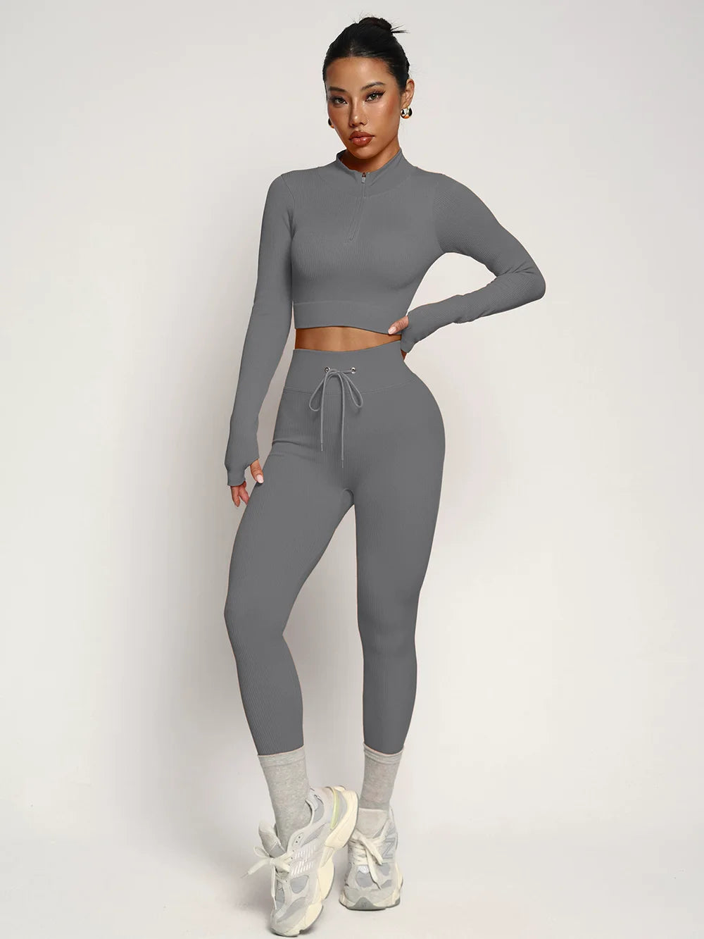 Fashionable two-piece yoga suit by Corporación Turística, stylish activewear for comfortable workouts and yoga sessions.