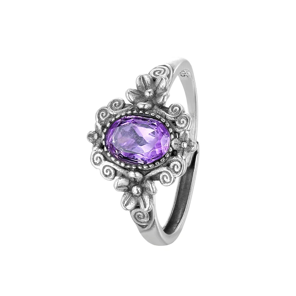 Sterling silver 925 amethyst ring with a 7x5mm oval gemstone, featuring a vibrant red color, handcrafted by Corporación Turística.