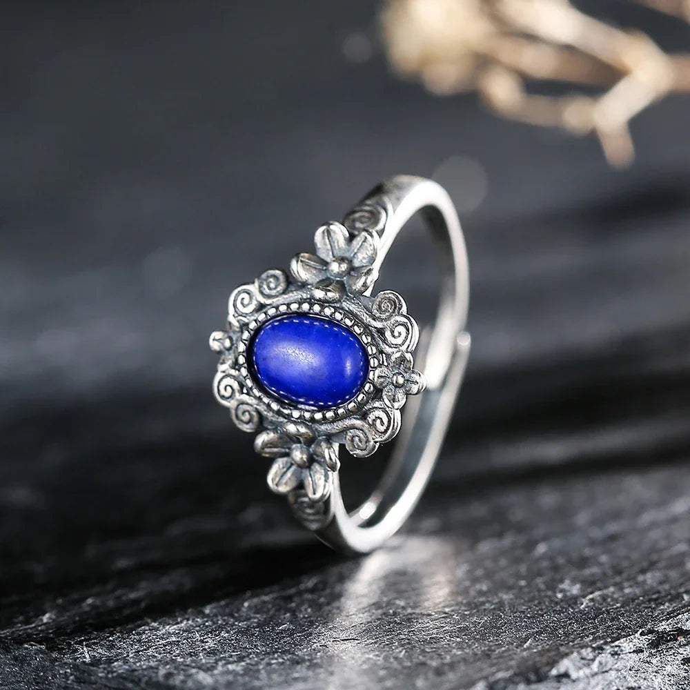 Sterling silver 925 amethyst ring with 7x5mm gemstone, featuring a red garnet design, handcrafted by Corporación Turística.