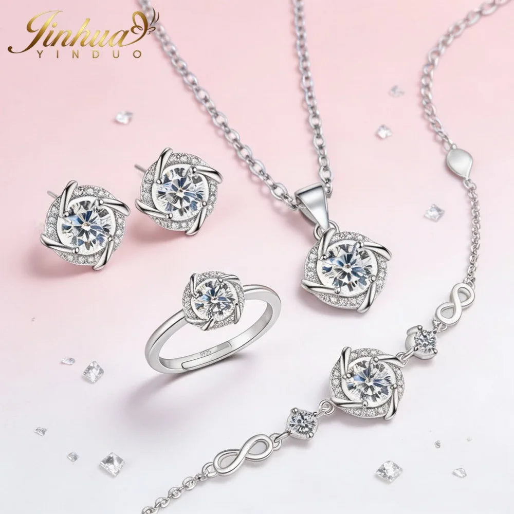 Classic sterling silver jewelry set with blue stones, featuring elegant necklaces and earrings from Corporación Turística.