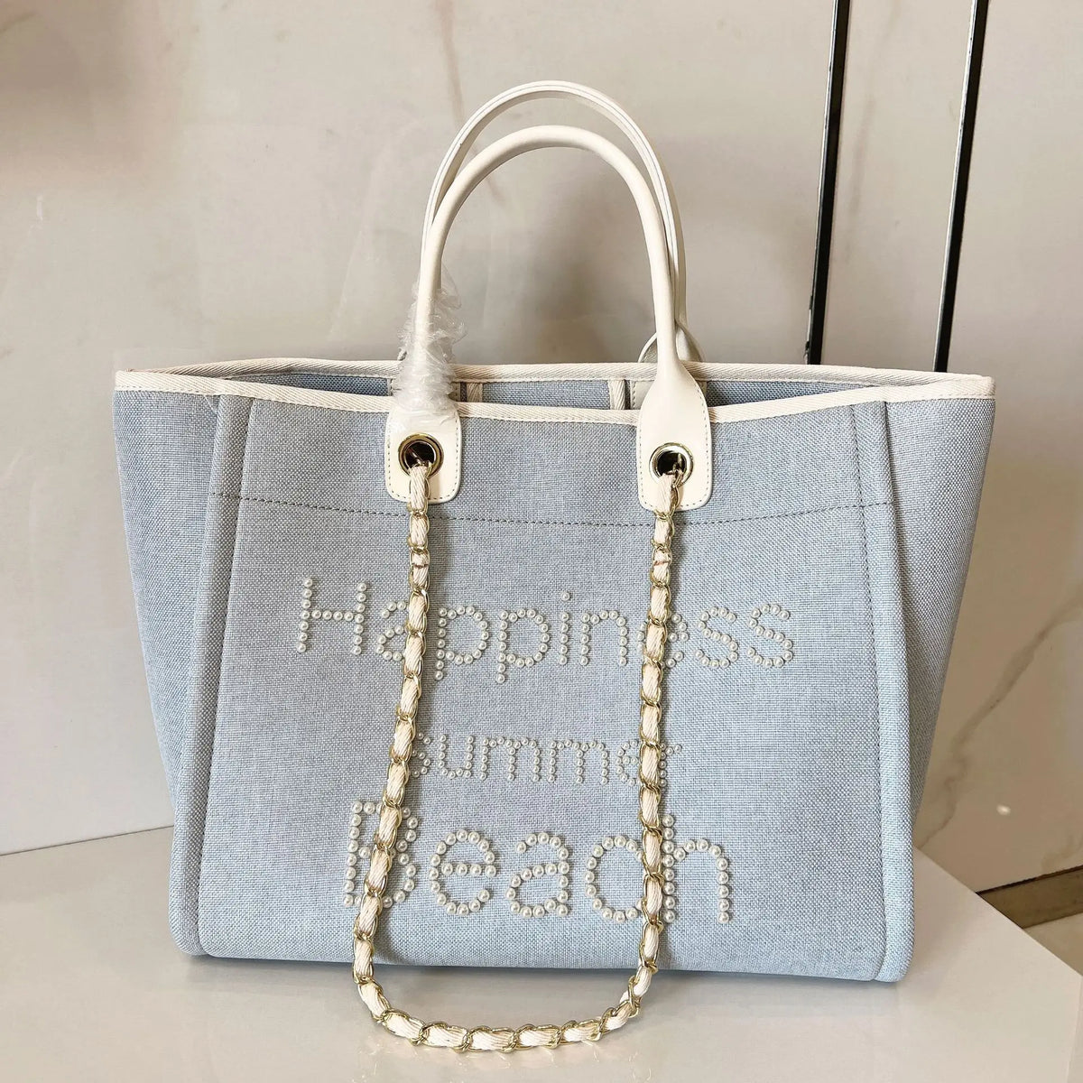 Large women's canvas and leather shoulder bag by Corporación Turística, featuring durable canvas and genuine leather accents.