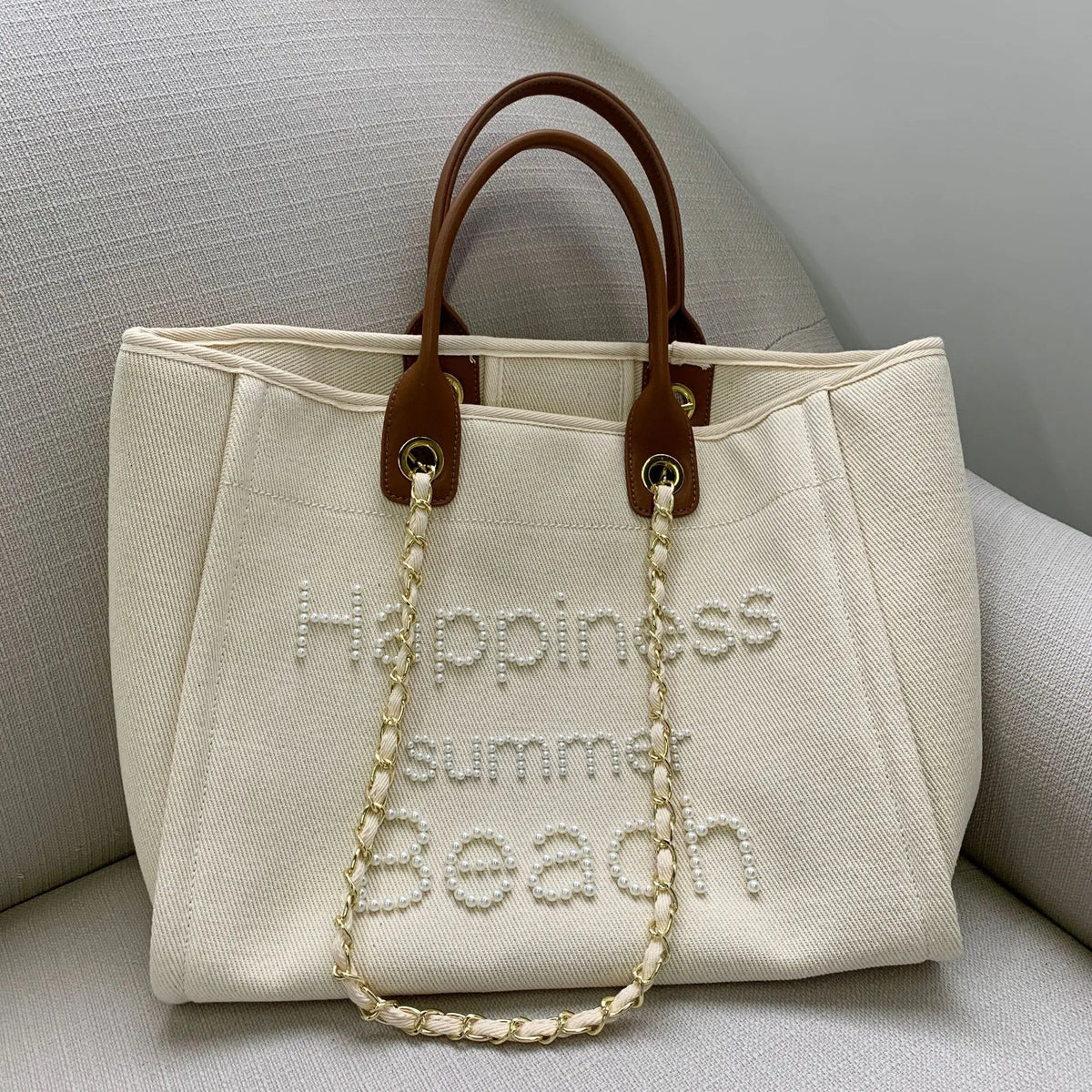 Large women’s canvas and leather shoulder bag by Corporación Turística, featuring spacious design and stylish leather accents.