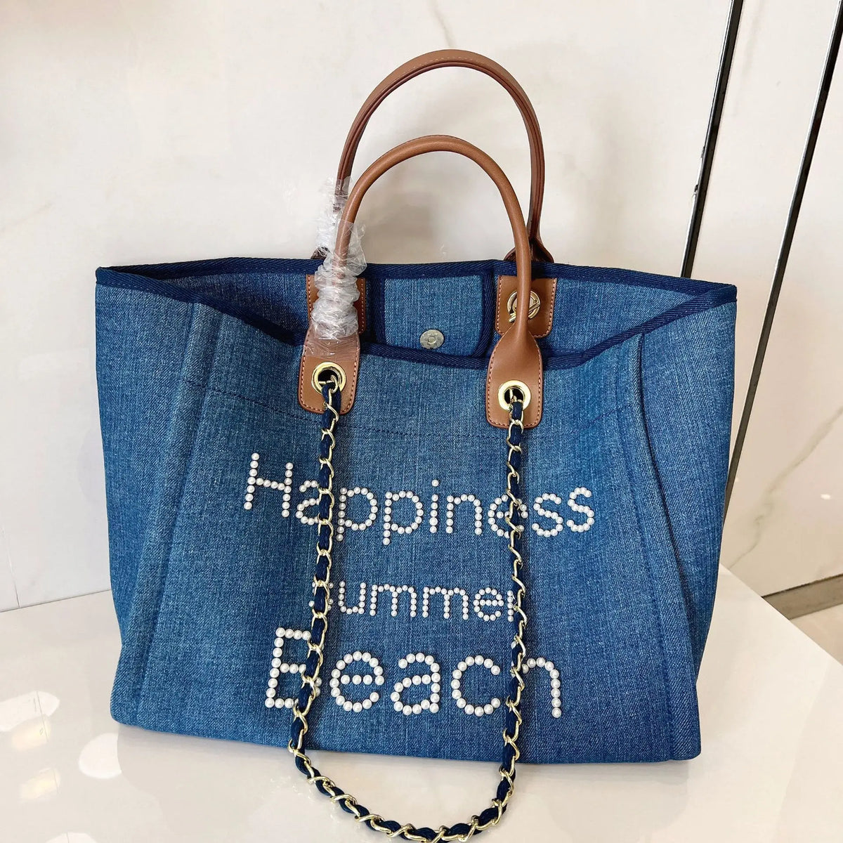 Large genuine leather and canvas shoulder bag for women, stylish and spacious tote from Corporación Turística.