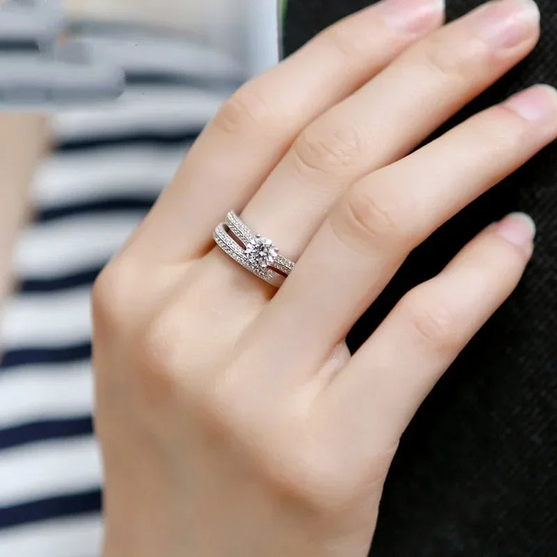 Sterling silver 925 two-in-one ring with gold accents, stylish unisex jewelry by Corporación Turística, close-up view of the ring design.