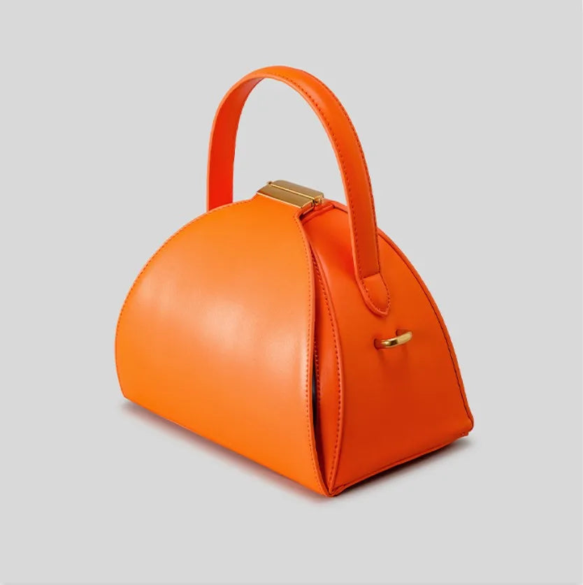 Gold PU shoulder bag for women with niche design, stylish and compact from Corporación Turística, 22x14x19cm.