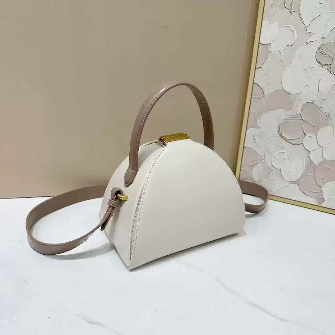 Gold PU shoulder bag for women with niche design, rectangular shape, and adjustable strap, stylish and functional.