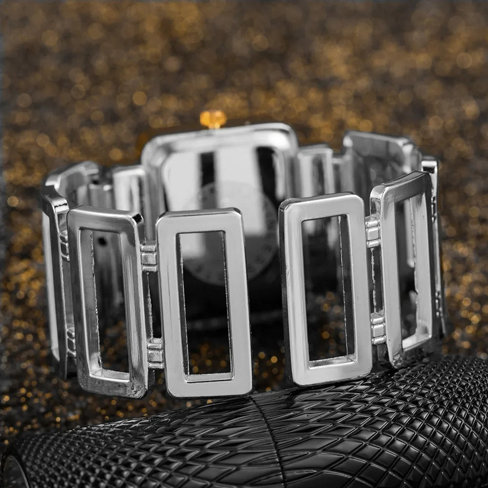 Gold and black rectangular Cansnow women's wristwatch with a sleek bracelet design by Corporación Turística.
