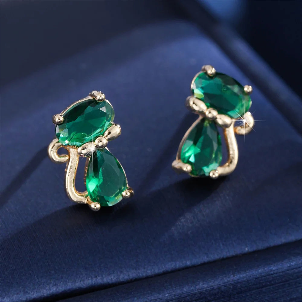 Small green cat-shaped earrings with zirconia accents, stylish jewelry by Corporación Turística.