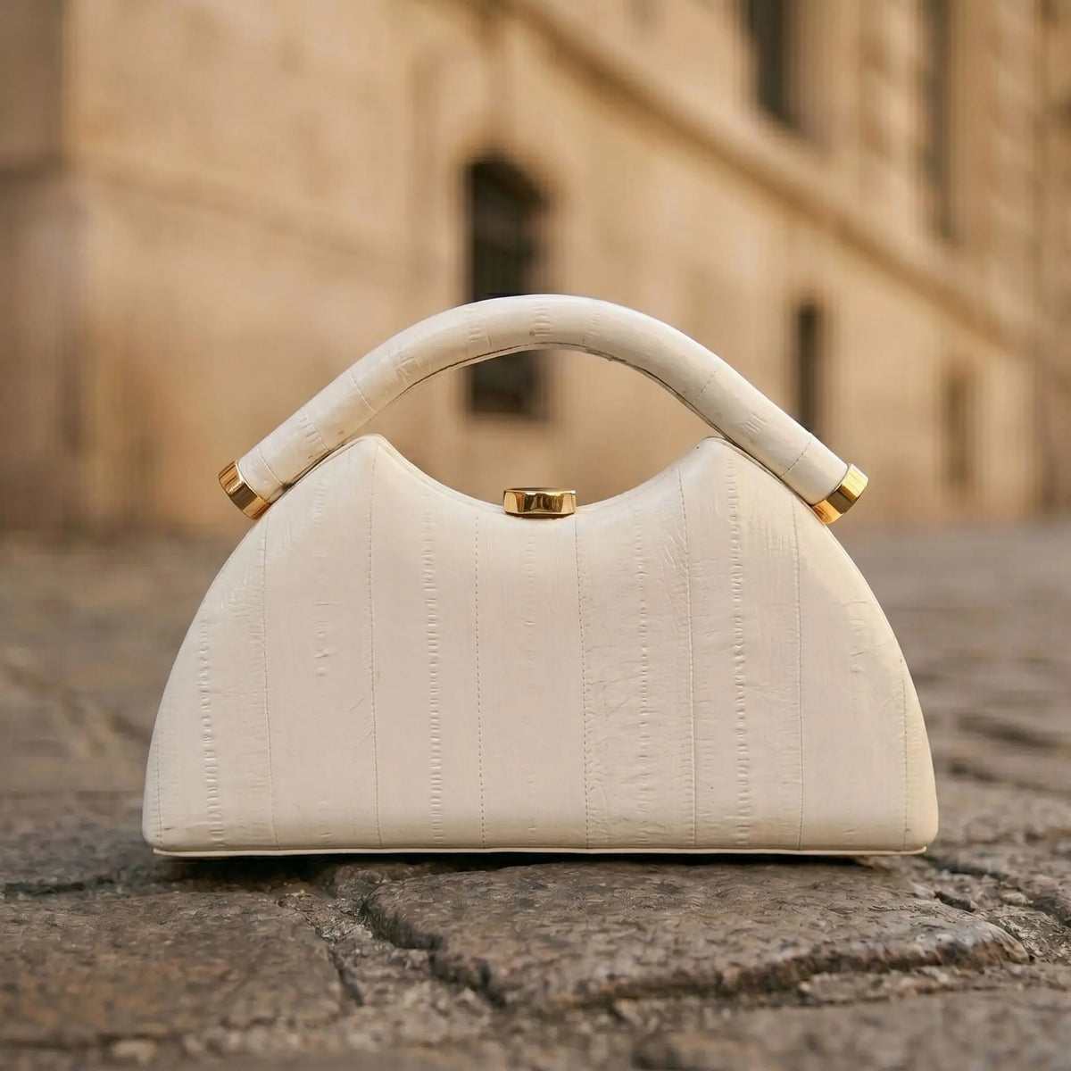 Gold Luna-shaped evening clutch bag for women, stylish and elegant hand-held purse by Corporación Turística.