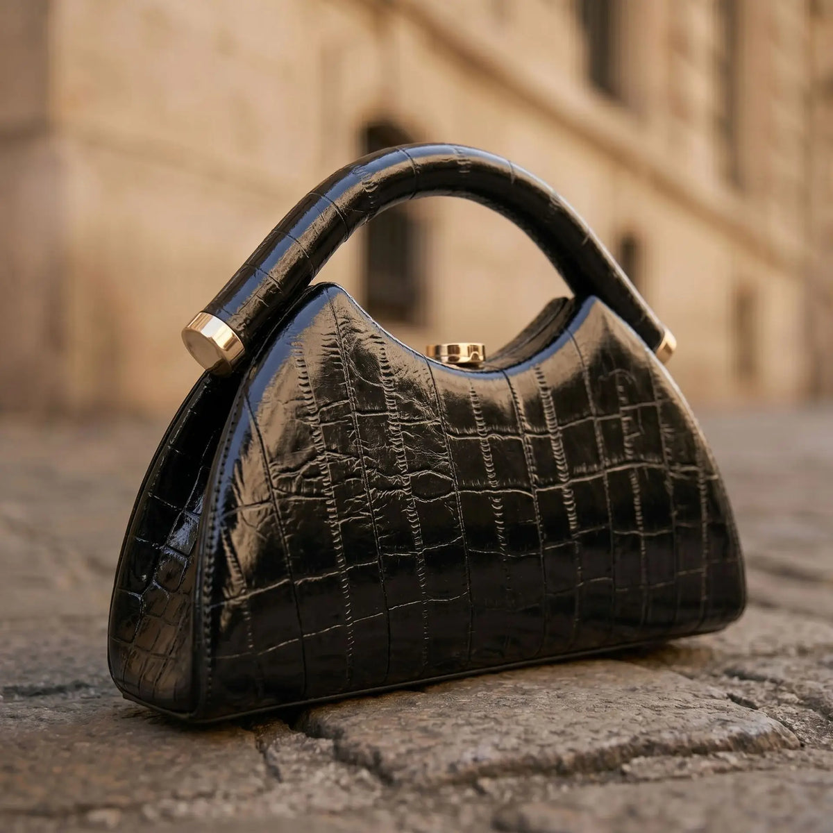 Gold Luna-shaped evening clutch bag for women, elegant hand-held purse from Corporación Turística.
