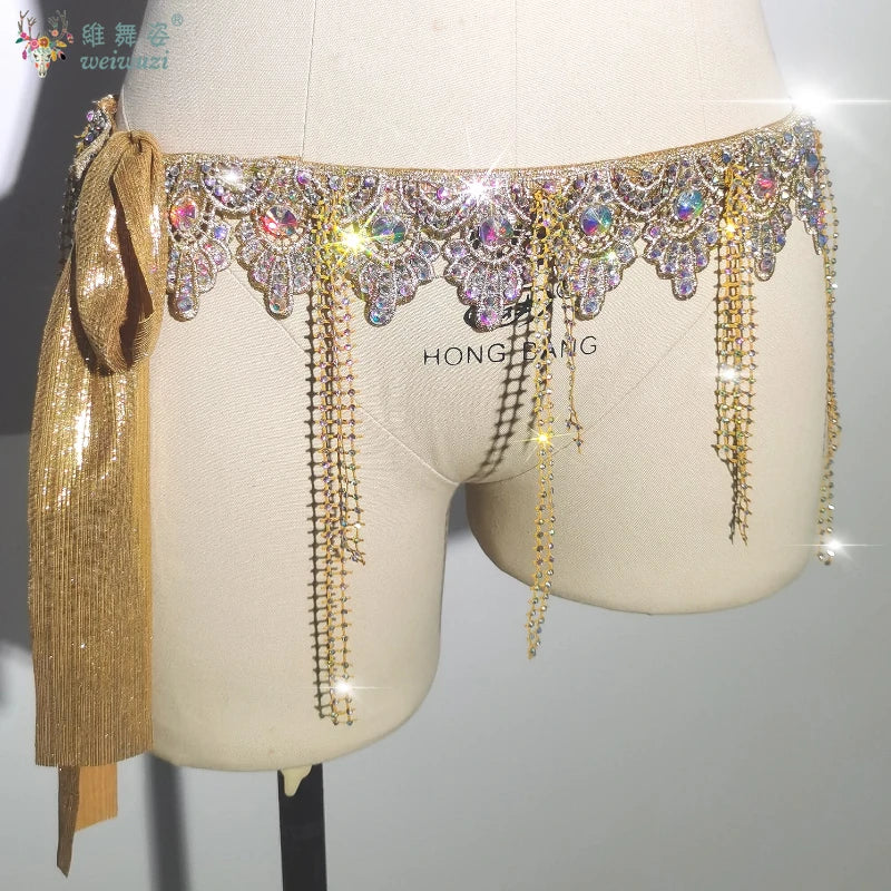 Gold belly dance performance belt for women by Corporación Turística, featuring intricate beadwork and adjustable fit.