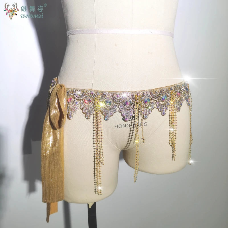 Gold belly dance performance belt for women by Corporación Turística, featuring intricate design and adjustable fit.