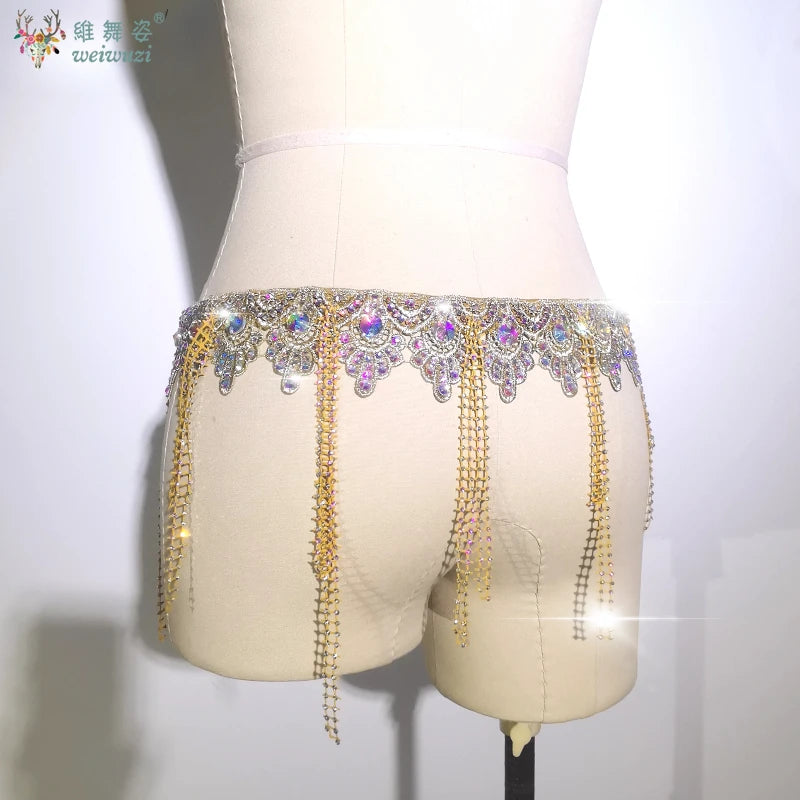 Gold belly dance performance belt for women by Corporación Turística, featuring intricate design and embellishments for dance costumes.