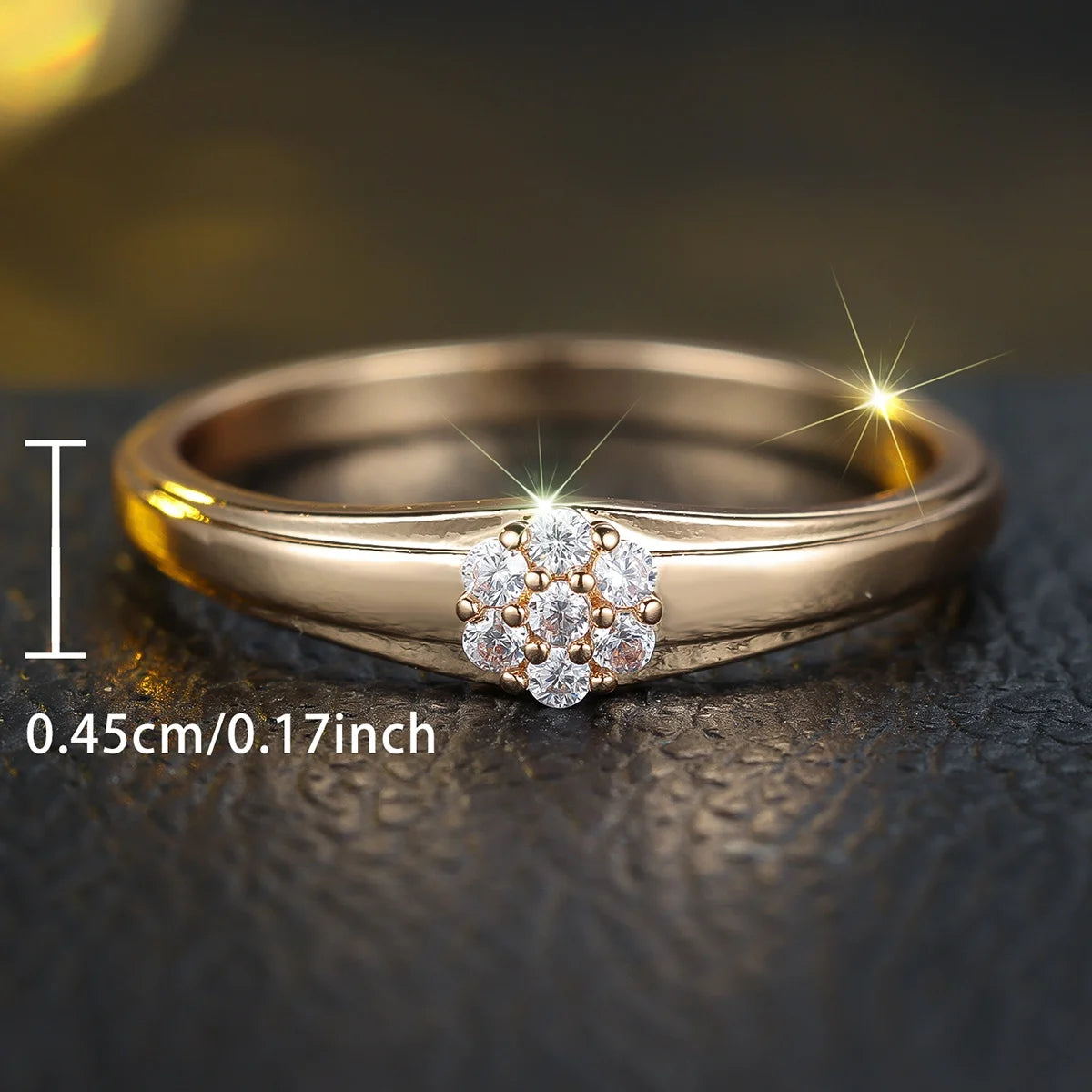Luxury women's engagement ring with clear cubic zirconia, gold-tone band, elegant design by Corporación Turística.