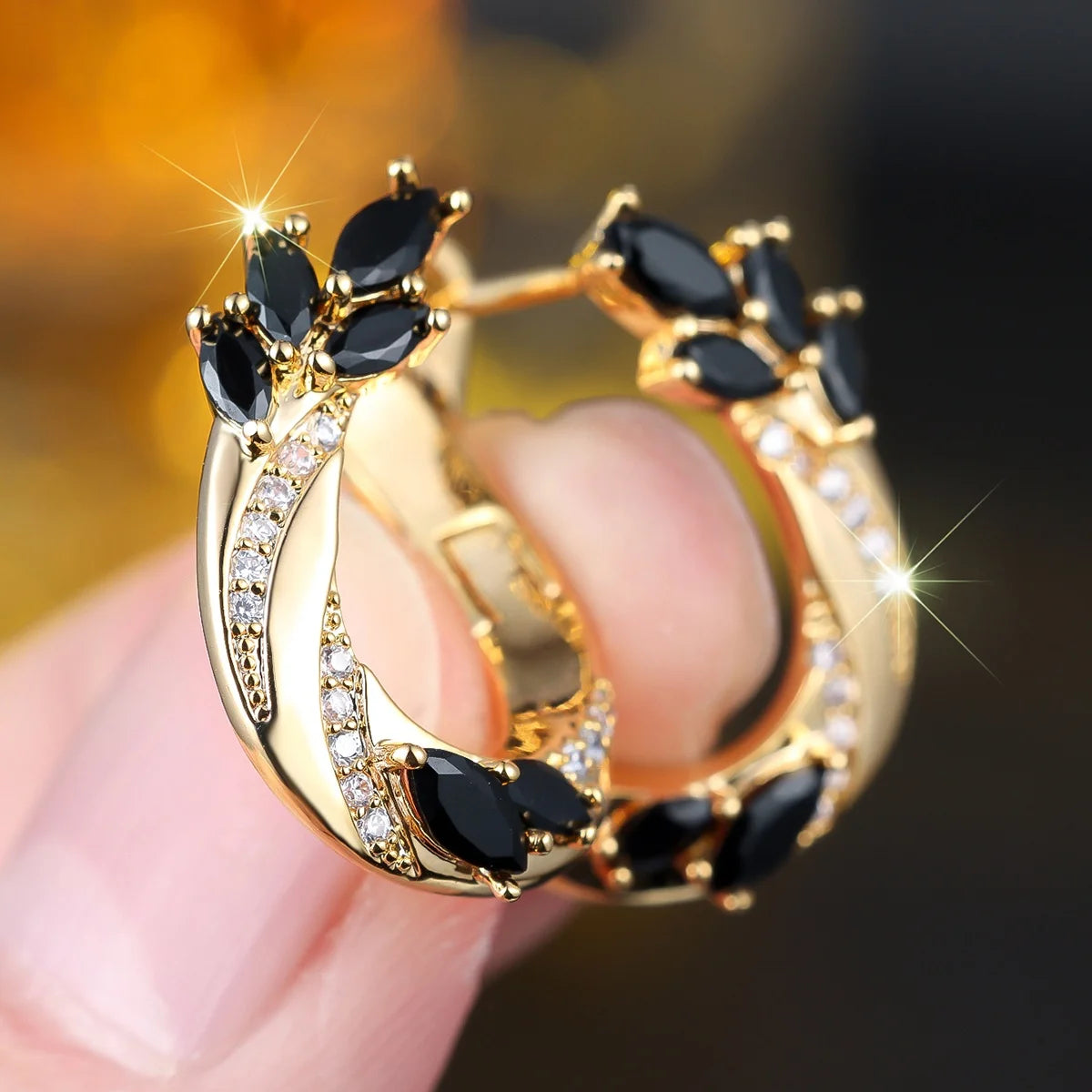 Elegant gold oval hoop earrings for women, featuring circular design, by Corporación Turística
