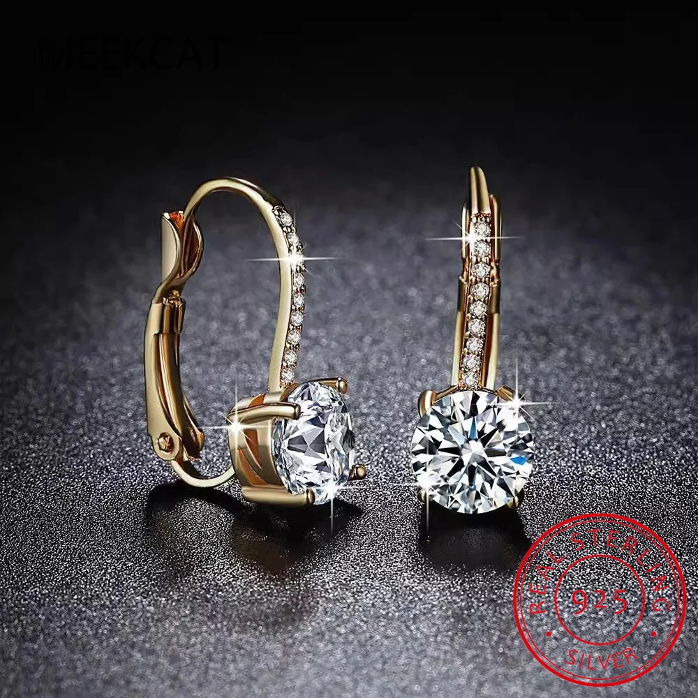 18K gold hoop earrings with sparkling moissanite gemstones, featuring elegant circular design and high-quality craftsmanship.