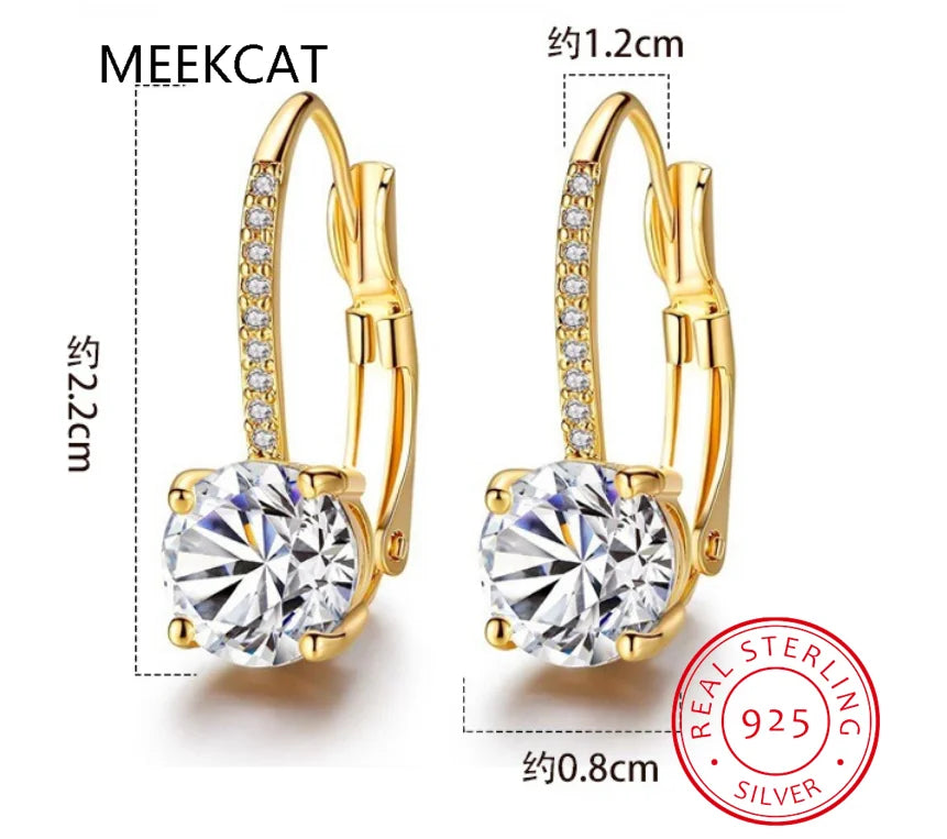 18K gold hoop earrings with sparkling moissanite stones, featuring elegant and modern jewelry design.
