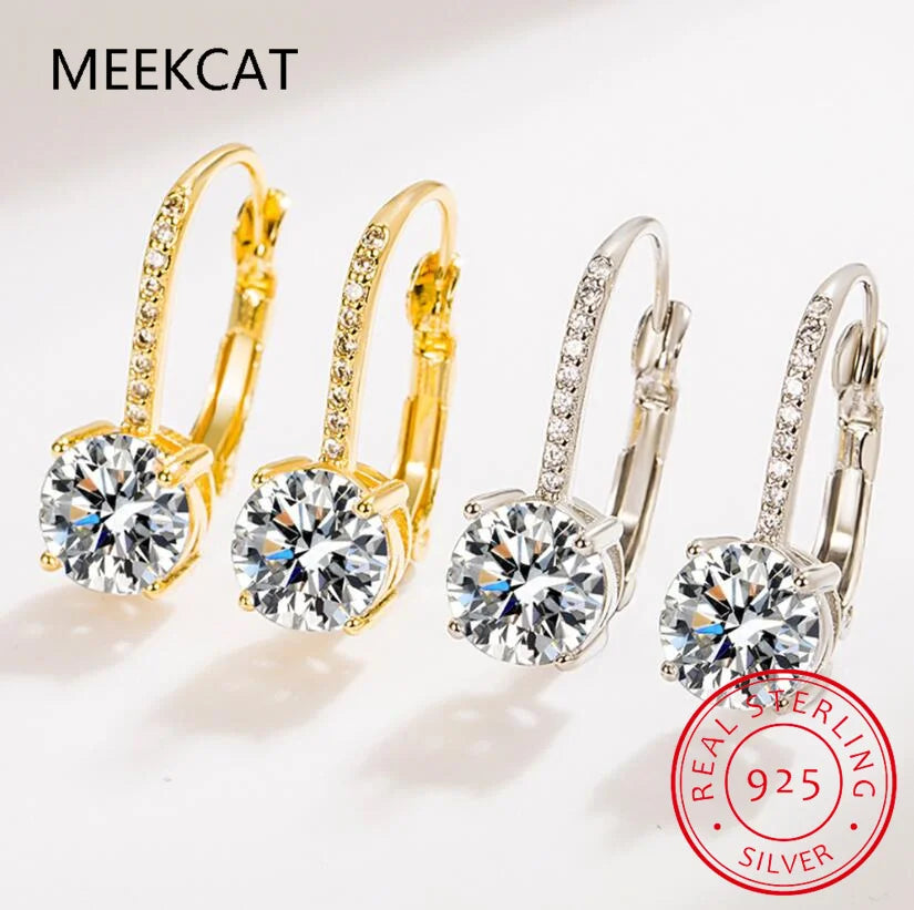18K gold hoop earrings with sparkling moissanite stones, showcasing elegant jewelry design and craftsmanship.