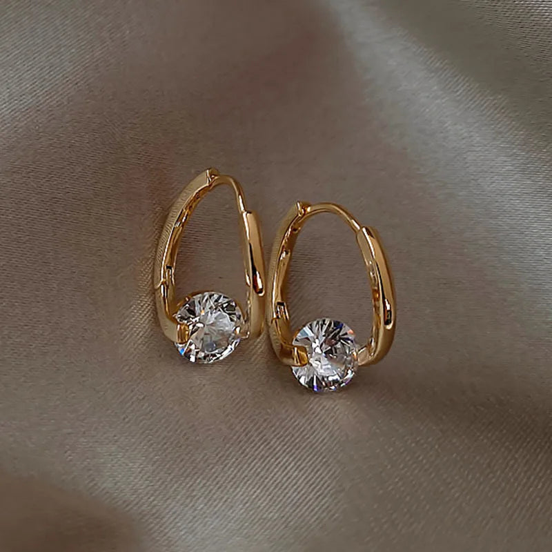 Gold and white Korean fashion zircon pendant earrings for women, showcasing elegant dangling jewelry from Corporación Turística.