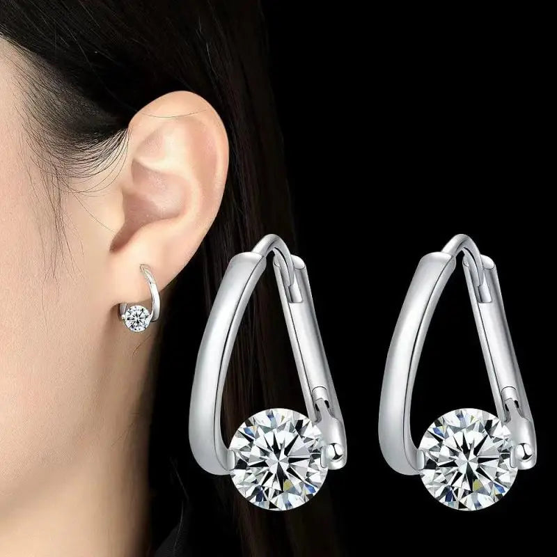 Gold and white Korean fashion zircon pendant earrings for women, featuring elegant dangling design from Corporación Turística.