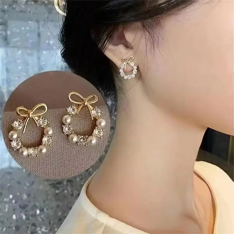 Gold and white Korean fashion zircon dangling earrings with intricate design, perfect for stylish women.