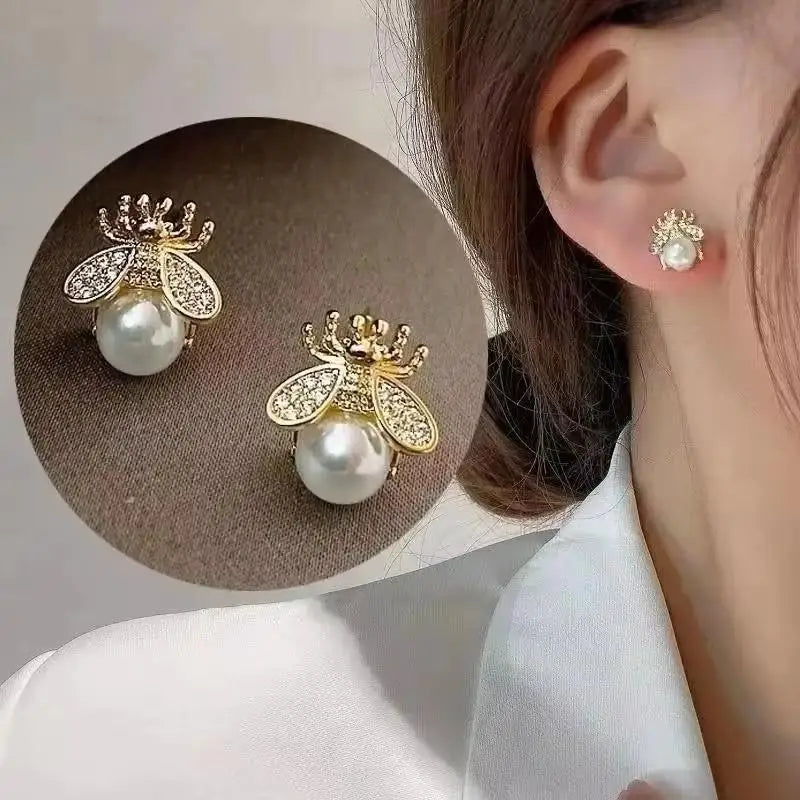 Gold and white Korean fashion zircon pendant earrings with dangling design, stylish jewelry for women.