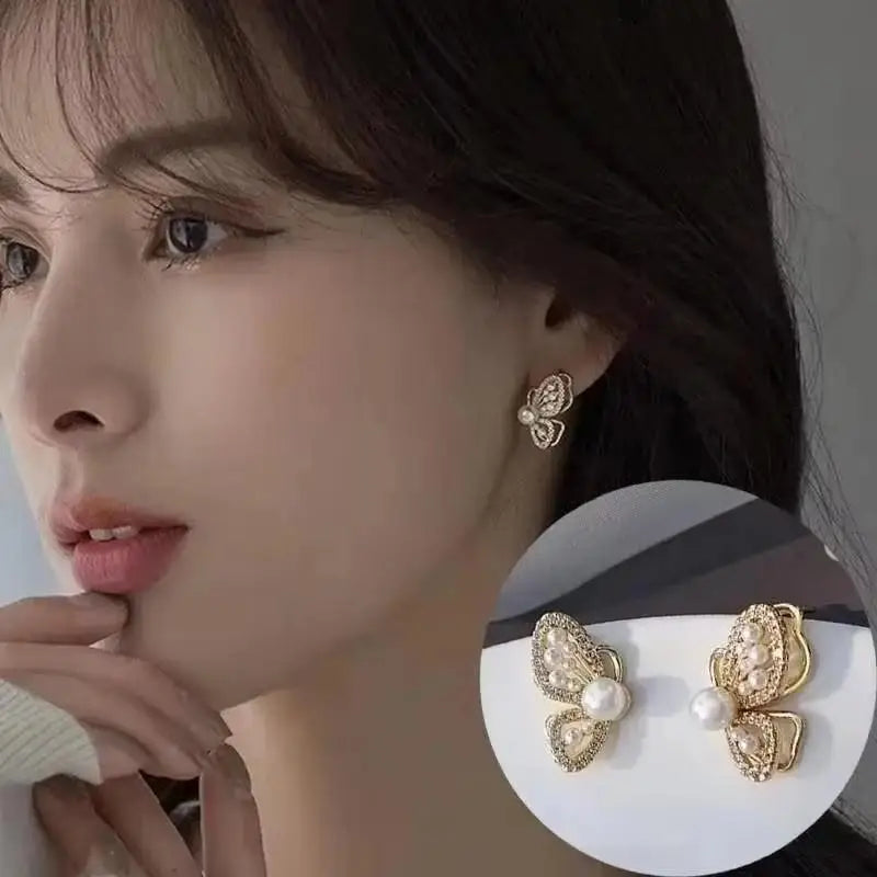 Gold and white Korean fashion zircon dangling earrings with intricate design, perfect for stylish women.