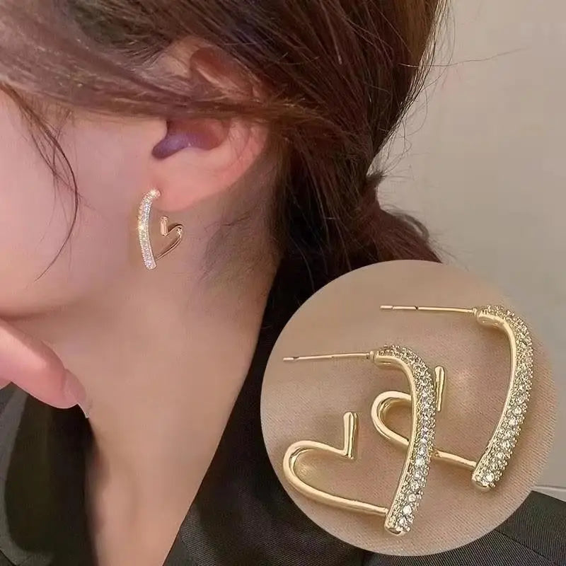 Gold and white Korean fashion zircon dangling earrings with intricate design, perfect for stylish women.