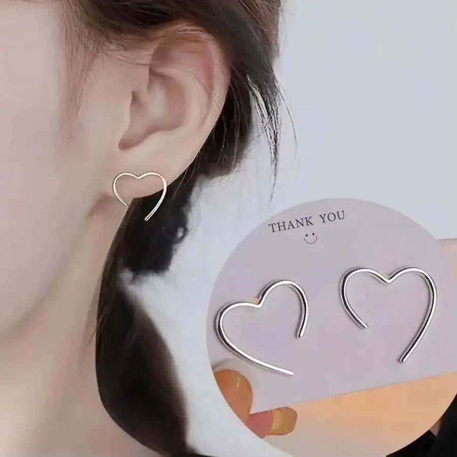 Gold and white Korean fashion zircon dangling earrings with intricate design, perfect for stylish women.