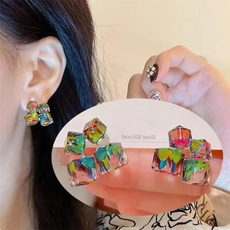 Gold and white Korean fashion zircon pendant earrings for women with dangling design from Corporación Turística.