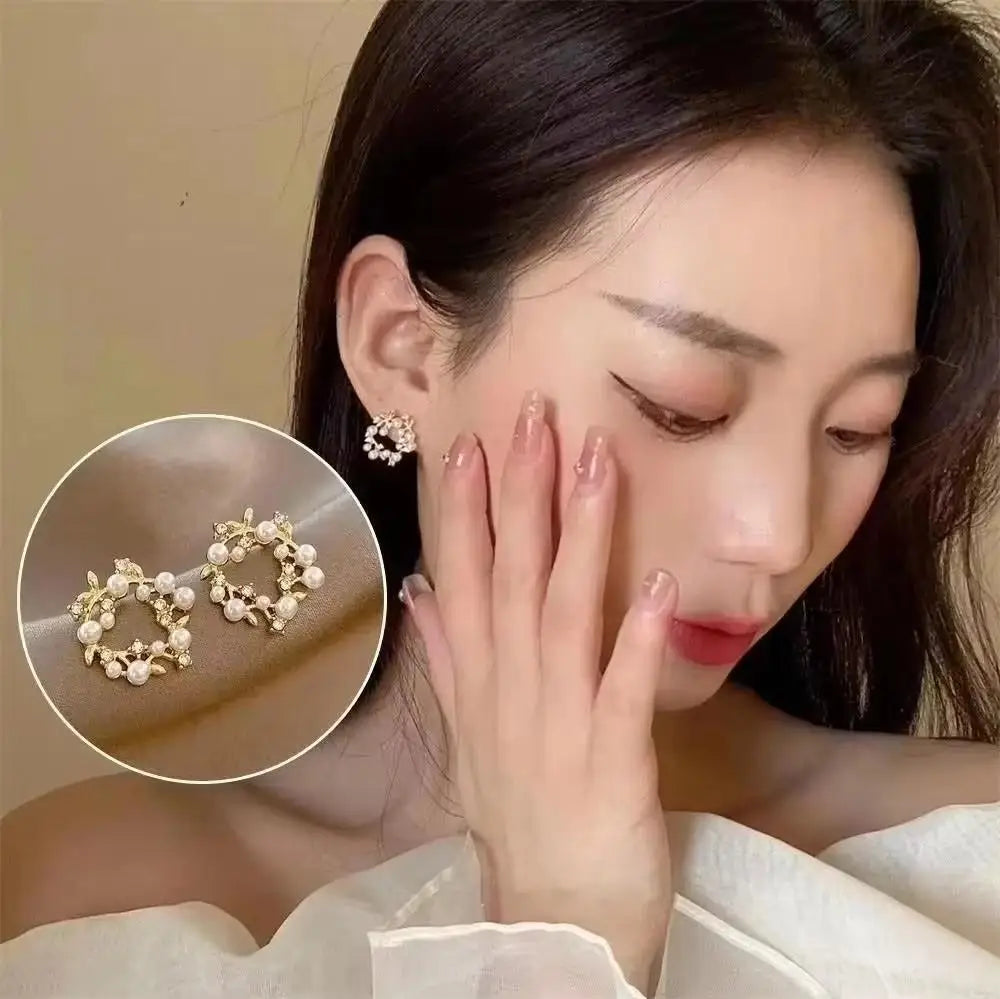 Gold and white Korean fashion zircon pendant earrings for women with dangling design, stylish and elegant jewelry.