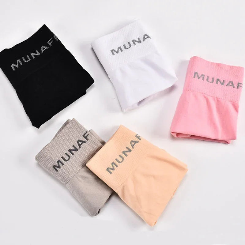 Set of four gray women's fitted safety shorts from Corporación Turística, designed for secure fit and comfort.