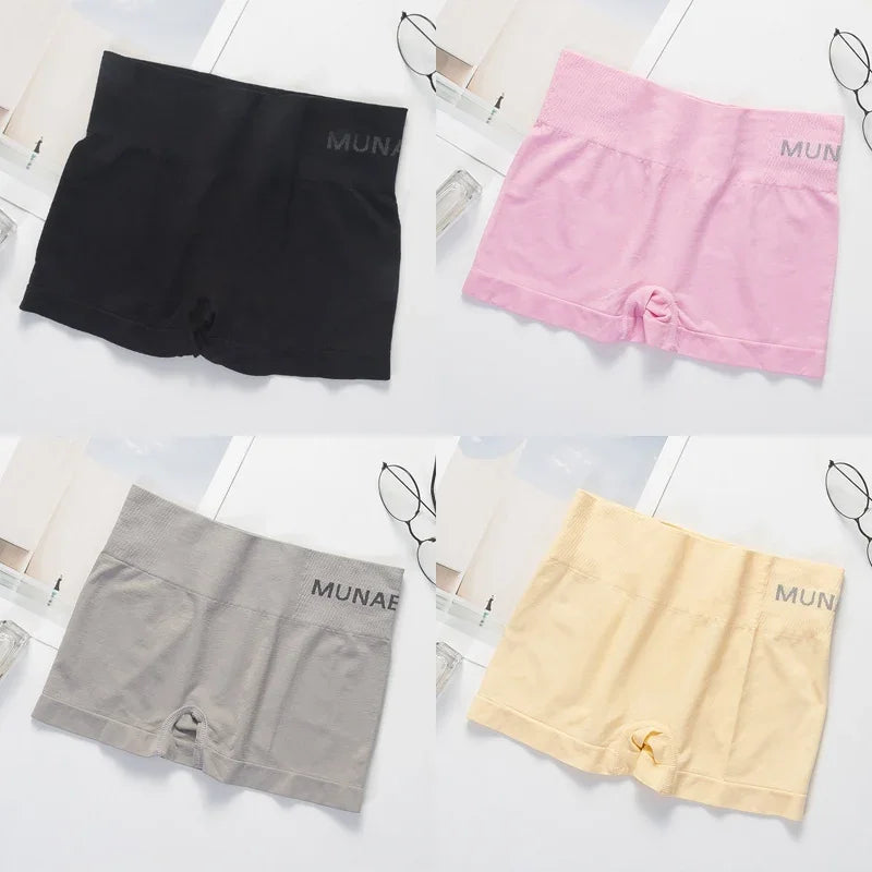 Four pairs of gray women's fitted safety shorts from Corporación Turística, designed for secure fit and comfort.